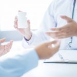 Doctor explains prescription to a patient