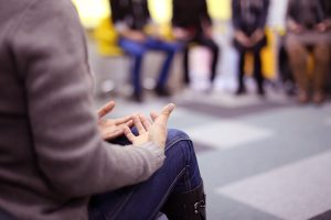 Person speaks at a support group