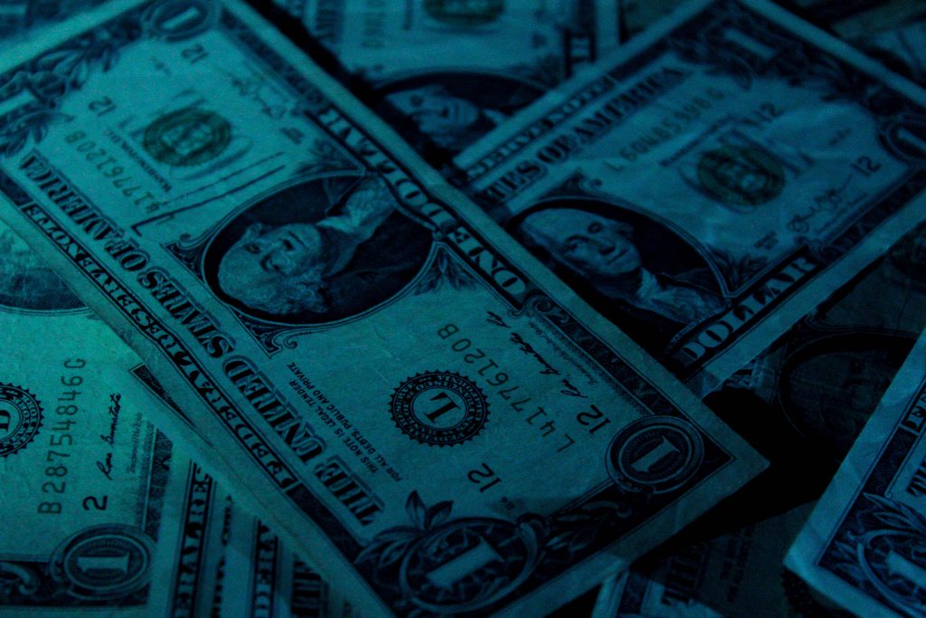American money under low lighting