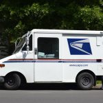 Mailman dropping off package