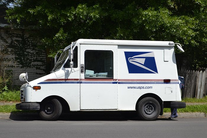 Mailman dropping off package