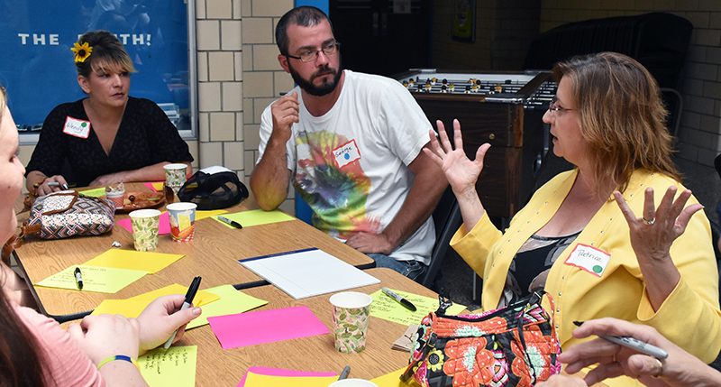 Community members in Parkersburg discuss the addiction crisis.