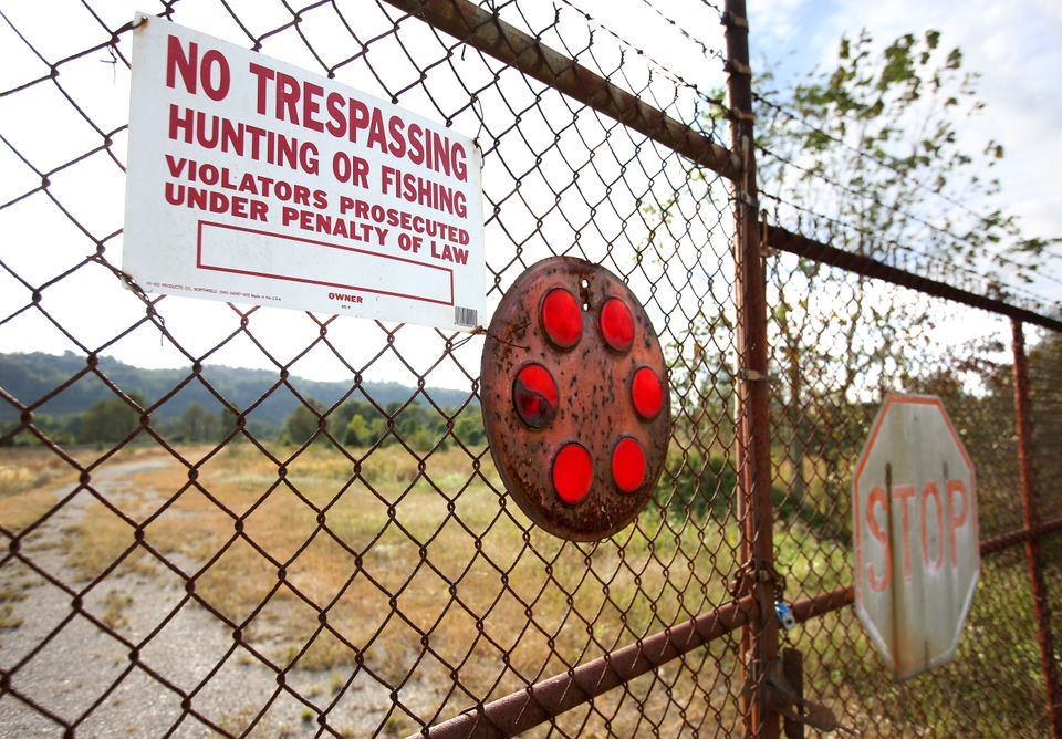 A fence with a no trespassing sign.