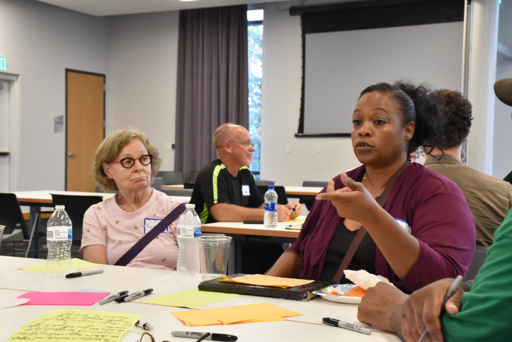 Participants in the Your Voice Ohio forum at the downtown Dayton Metro Library, Monday, Sept. 30, 2019 discuss ways to improve their community. 